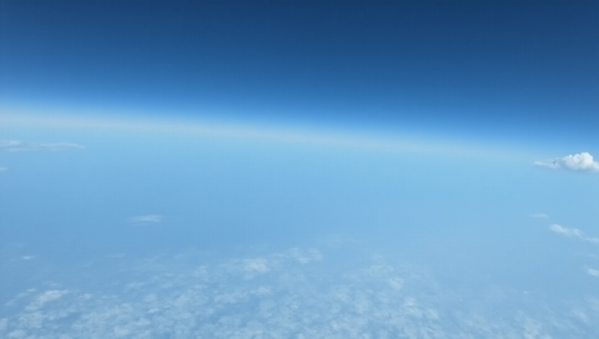 Clear blue sky with light clouds, perfect for skydiving