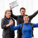 Group of people celebrating after a skydive